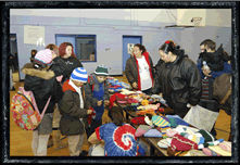 Families in Buffalo, NY USA choosing knitted goods supplied by Global Knitters through Dream Centre Ministries
